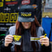 girl holding stickers